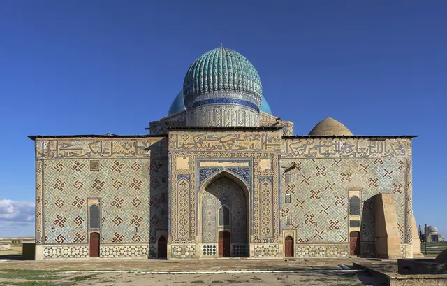 Turkestan: tiled rear facade and ribbed turquoise dome of the Yasawi mausoleum